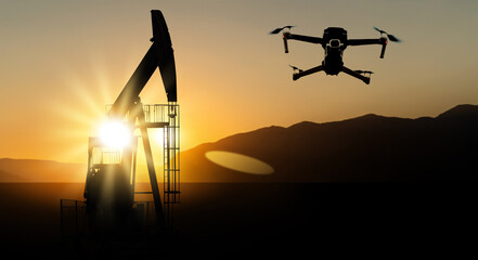 Silhouettes of drone and oil rigs	