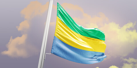 Gabon national flag cloth fabric waving on the sky - Image