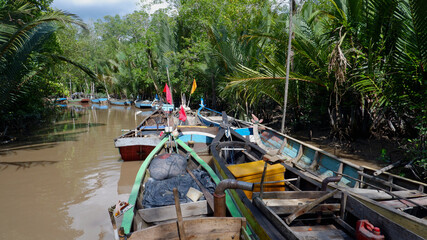 Fishing boats in group, indonesian rural river port
