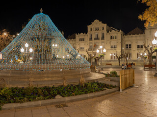 Plaza de Navarra in Huesca where the casino building is located, decorated with led Christmas lights in the center of Huesca capital