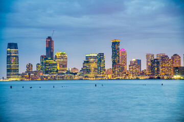 Jersey City, NJ. Buildings of Jersey City at night along Hudson River