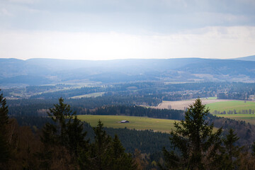 A romantic view of the beautiful valleys and arable fields from the Stołowe Mountains, a distant view to the horizon, a large space that gives a sense of freedom and independence. Polish Karkonosze, b