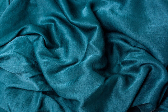 Dark Green Satin Fabric Top View. Fold Background