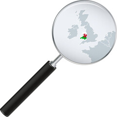 Wales map with flag in magnifying glass.