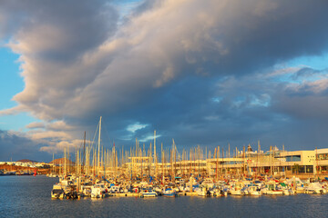 Obraz premium Boats and yachts moored at harbor . Yachts in Marina Lanzarote