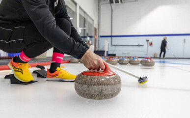 Curling stone on ice - 558875841