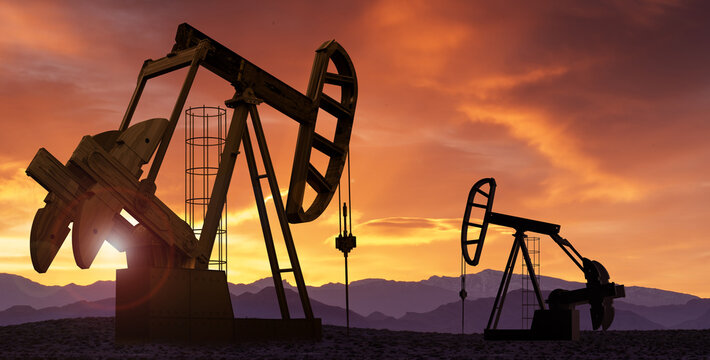 Oil pumps extracting crude at sunset. Oil drill and pump jack in oilfield.
