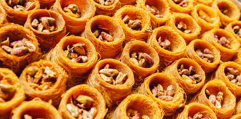 Kataifi Kadayif Kunafa Baklava Pastry Nests. Close up view of delicious pastry nest cookies dessert...