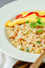 Omelet rice dish served on a white plate