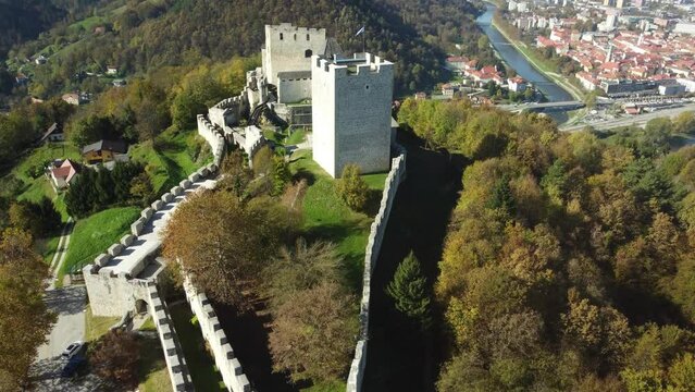 Drone footage of Celje Castle in Celje, Slovenia with a view of the cityscape of Celje town. Aerial.