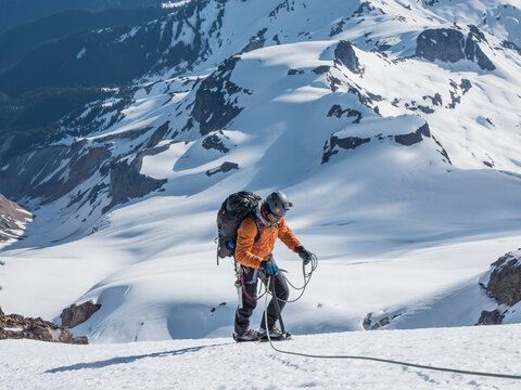 A man climbs the Cockscomb route on Mount Baker, Washington.