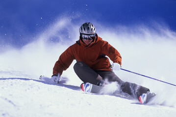 Man carving on his skis at Alta, Utah