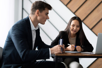 young male job seeker is having an interview in the office