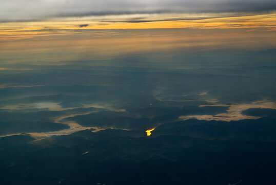 Sunrise over the Smokey Mountains with fog lining the river.