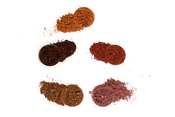 Eyeshadow crushed palette, colorful eye shadow powder isolated on a white background.