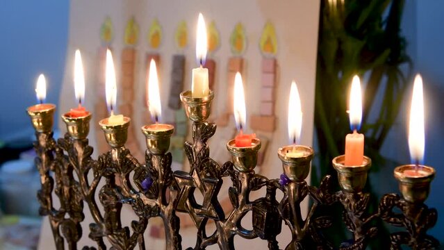 4K close up video of the Jewish menorah lit with all eight candles during the Hannukah Holiday- Israel
