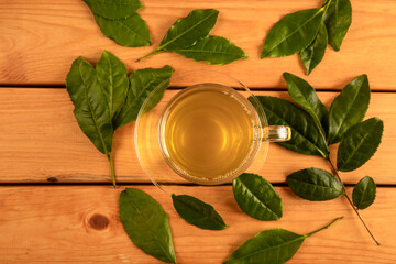 Tea leaves with a glass cup of green tea,top view 