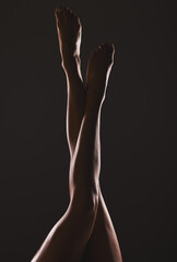 Woman with legs, body and beauty with pedicure, dark silhouette and mysterious aesthetic with black...