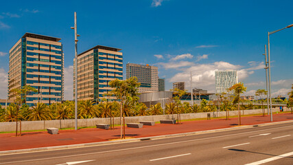 Traditional Mediterranean coastline modern architecture in Barcelona at summer sunny hot day and blue sky during warm sunset colors.