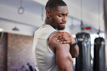 Exercise, black man and shoulder pain for training, fitness and workout for wellness in gym....