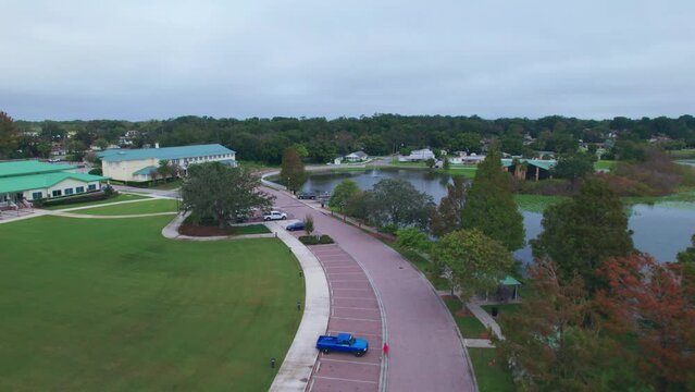 Aerial flyover of Starke Lake and the charming and quaint city of Ocoee, Florida.  Ocoee is a family oriented town with restaurants, breweries, bars, and shopping.