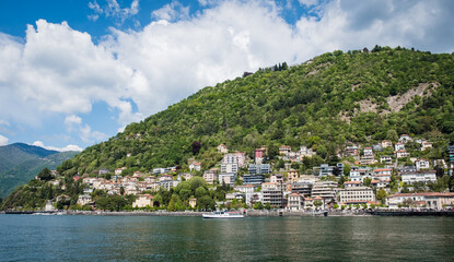Fototapeta na wymiar Scenery and landscape around lake Como in Northern Italy. A beautiful view over lake (Lago di Como) in Como town.
