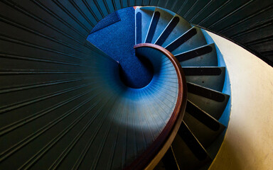 high angle photography of blue spiral staircase blue and black spiral staircase - Powered by Adobe