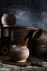 Clay pots on a rustic table