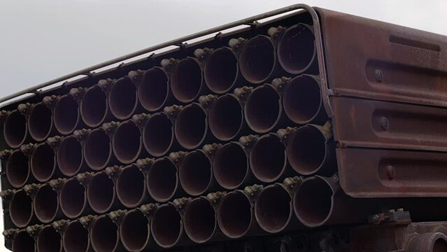 The old Soviet multiple launch rocket system BM-21 Grad on the chassis of a truck 375D. Broken and burnt military equipment of the Russian Federation on the territory of Ukraine. War 2022.