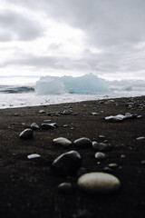 Chunks of ice washed up by the sea lie on the black beach of Breidamerkursandur ( Diamond Beach). They come from the broken icebergs from the glacier lagoon J&ouml;kuls&aacute;rl&oacute;n, which migrate into the sea.