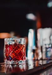 Cocktail Negroni with gin, campari martini rosso and orange. negroni cocktail at the bar