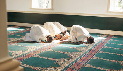 Muslim, prayer and mosque with a holy man group praying together for fajr, dhuhr or asr, otherwise maghrib or ishaa. Salah, worship and pray with islamic friends at ramadan for religion in sun rays - obrazy, fototapety, plakaty