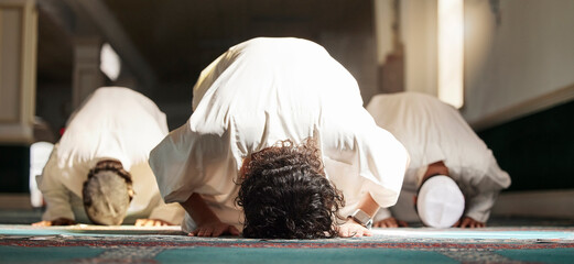 Muslim, prayer and mosque with a spiritual man group praying in faith during fajr, dhuhr or asr,...
