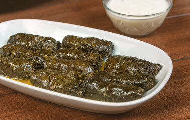 Dolma(tolma, sarma) - stuffed grape leaves with rice and meat. Armenian ,georgian or greek dolmades .Traditional Caucasian, Ottoman, Turkish and Greek cuisine..