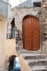 Fototapeta na wymiar Door to nowhere in Emporio at Santorini island in Greece