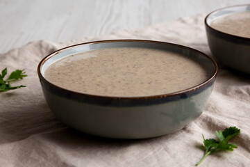 Homemade Cream of Mushroom Soup in a Bowl, side view.