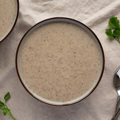 Homemade Cream of Mushroom Soup in a Bowl, top view. Flat lay, overhead, from above.