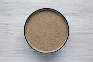 Homemade Cream of Mushroom Soup in a Bowl, top view. Flat lay, overhead, from above.