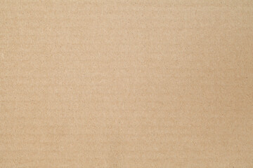 Fototapeta premium Cardboard surface, beige paper structure, rough background of recycled waste paper