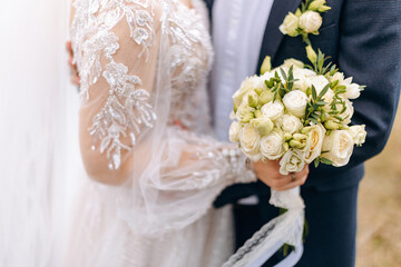 Wedding flowers. Bridal bouquet with exotic flowers. The bride is holding a bouquet. soft focus