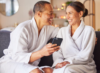 Senior couple, phone and relax spa wellness on sofa, beauty center and luxury body care or...