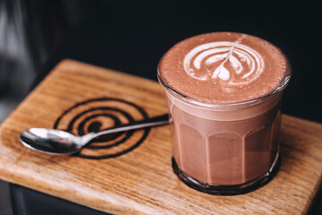 Cup of hot chocolate on cup holder