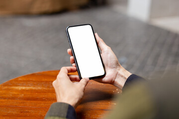 cell phone blank white screen mockup.hand holding texting using mobile on desk at office.background empty space for advertise.work people contact marketing business,technology