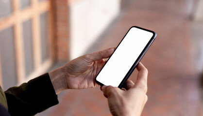 cell phone blank white screen mockup.hand holding texting using mobile on desk at office.background empty space for advertise.work people contact marketing business,technology