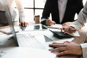 Asian business adviser meeting to analyze and discuss the situation on the financial report in the meeting room.Investment Consultant, Financial advisor and accounting concept