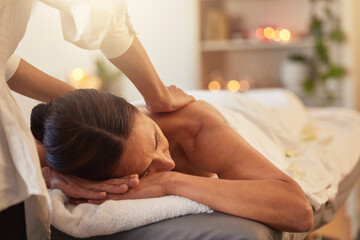 Obraz na płótnie Canvas Woman at spa for massage with therapist and holistic treatment, wellness and self care with aromatherapy. Luxury service, health and peace with skincare to relax at salon, masseuse hands for zen.