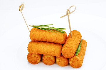 Heap of crispy cheese sticks fried in paneer and vegetable oil, traditional vegetarian snack