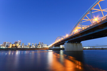 Fototapeta na wymiar Musashikosugi buildings and the Tama River before dawn