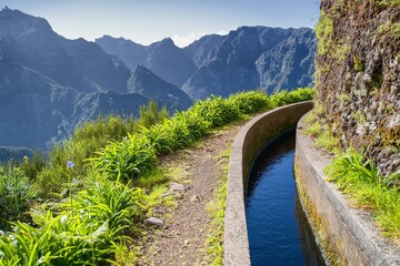View from Levada do Norte on the portuguese island of Madeira. Spring in Madeira. Levada irrigation canal. Hiking in Madeira. Path next to the levada. Hiking in Madeira, Portugal. Levada Norte. 