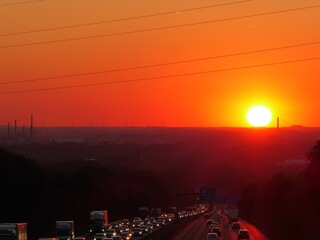 Sunset behind a Highway with traffic jam in Haan near Dusseldorf Germany